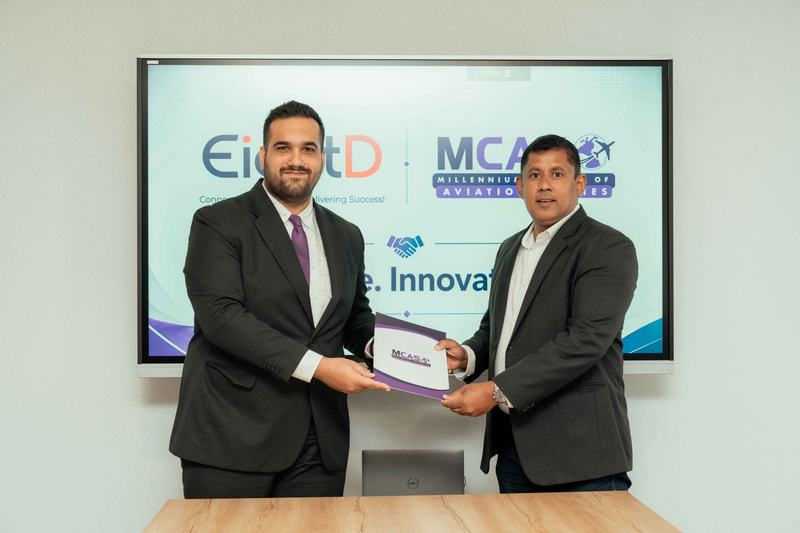 MCAS and EightD representatives exchange documents